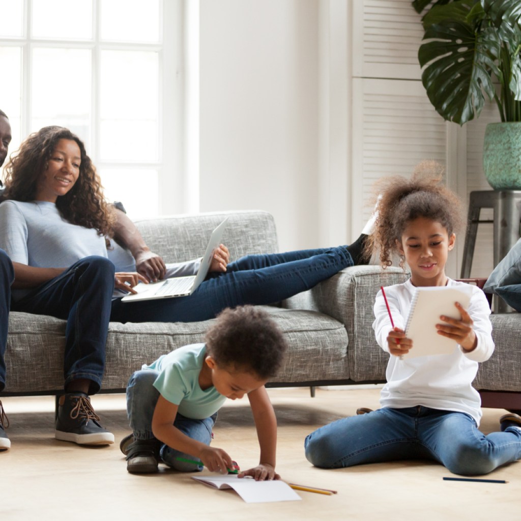 mom, dad, and two kids together in the living room