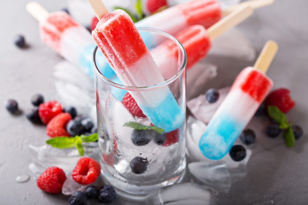Patriotic popsicle drink and a glass
