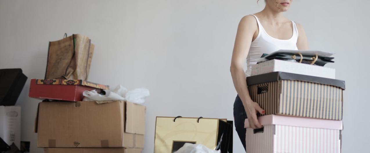A woman organizing and moving boxes