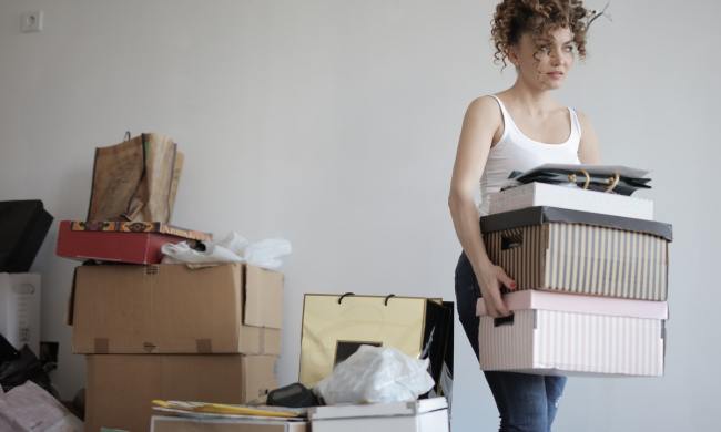 A woman organizing and moving boxes