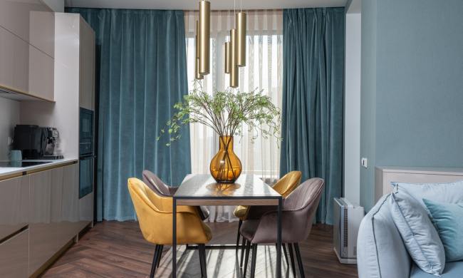 A dining area with clean lines and pops of color