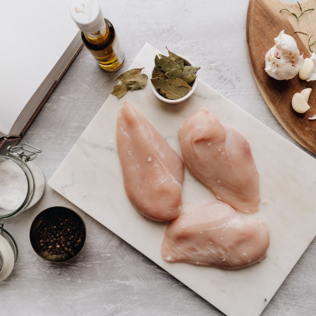 raw chicken breast with spices
