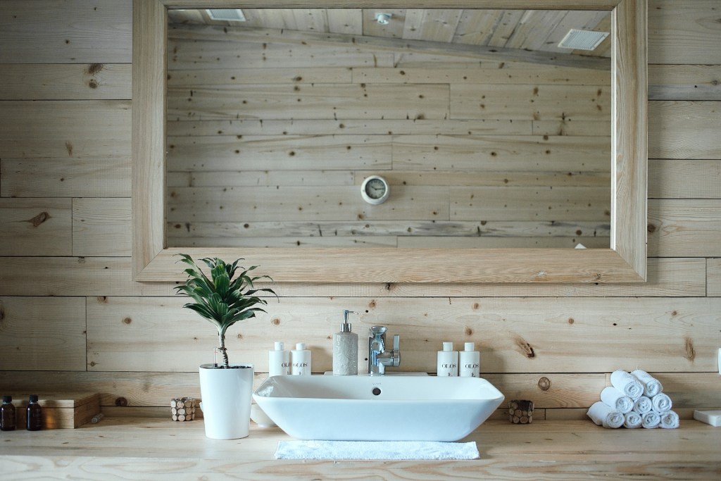 small bathroom with wood walls