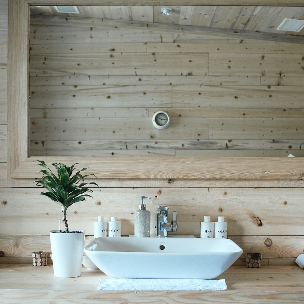 small bathroom with wood walls