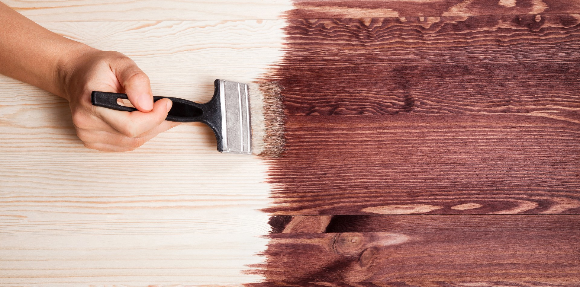 stain being painted on a table