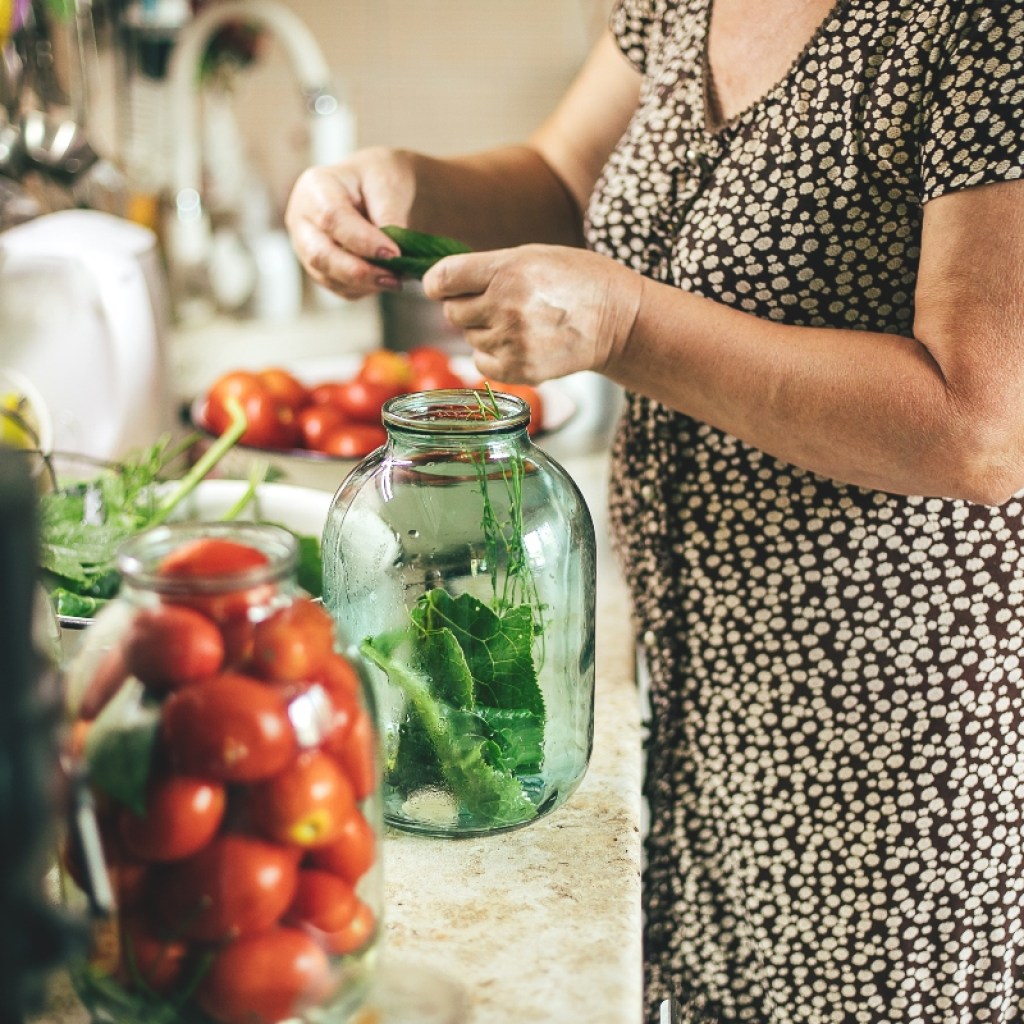 woman in kitchen pickling vegetables
