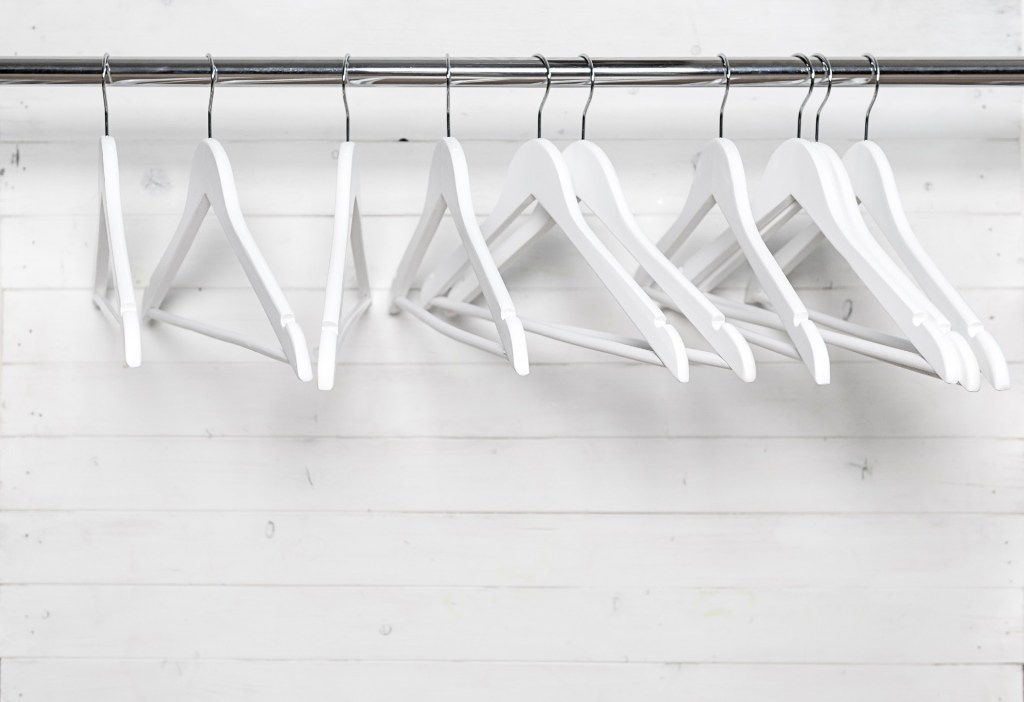 wooden hangers in a closet