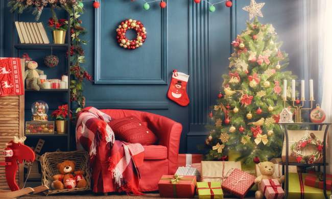 christmas living room setup with blue walls