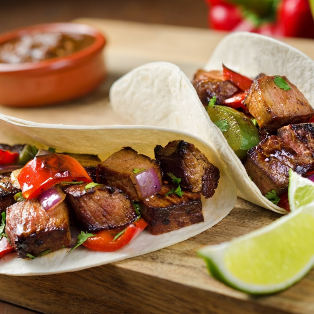 beef steak fajitas and tortillas on counter