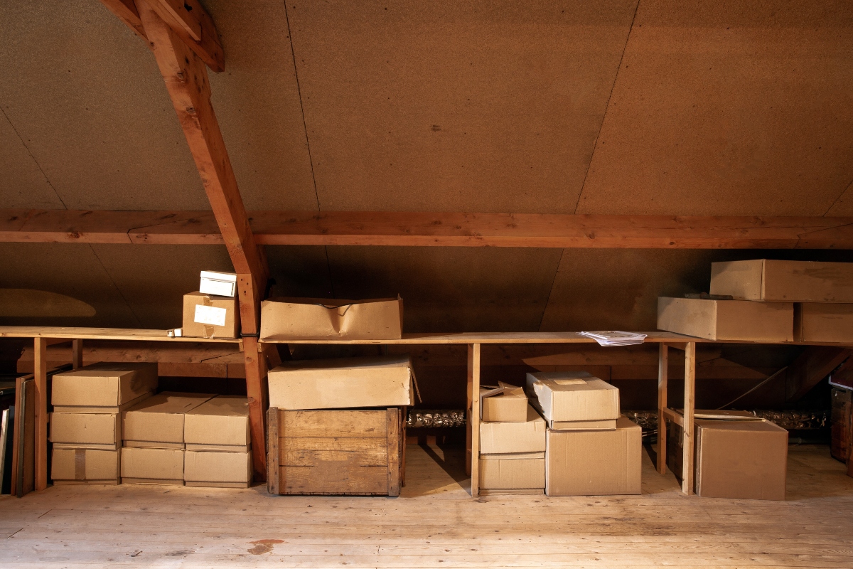 boxes on shelves in the attic
