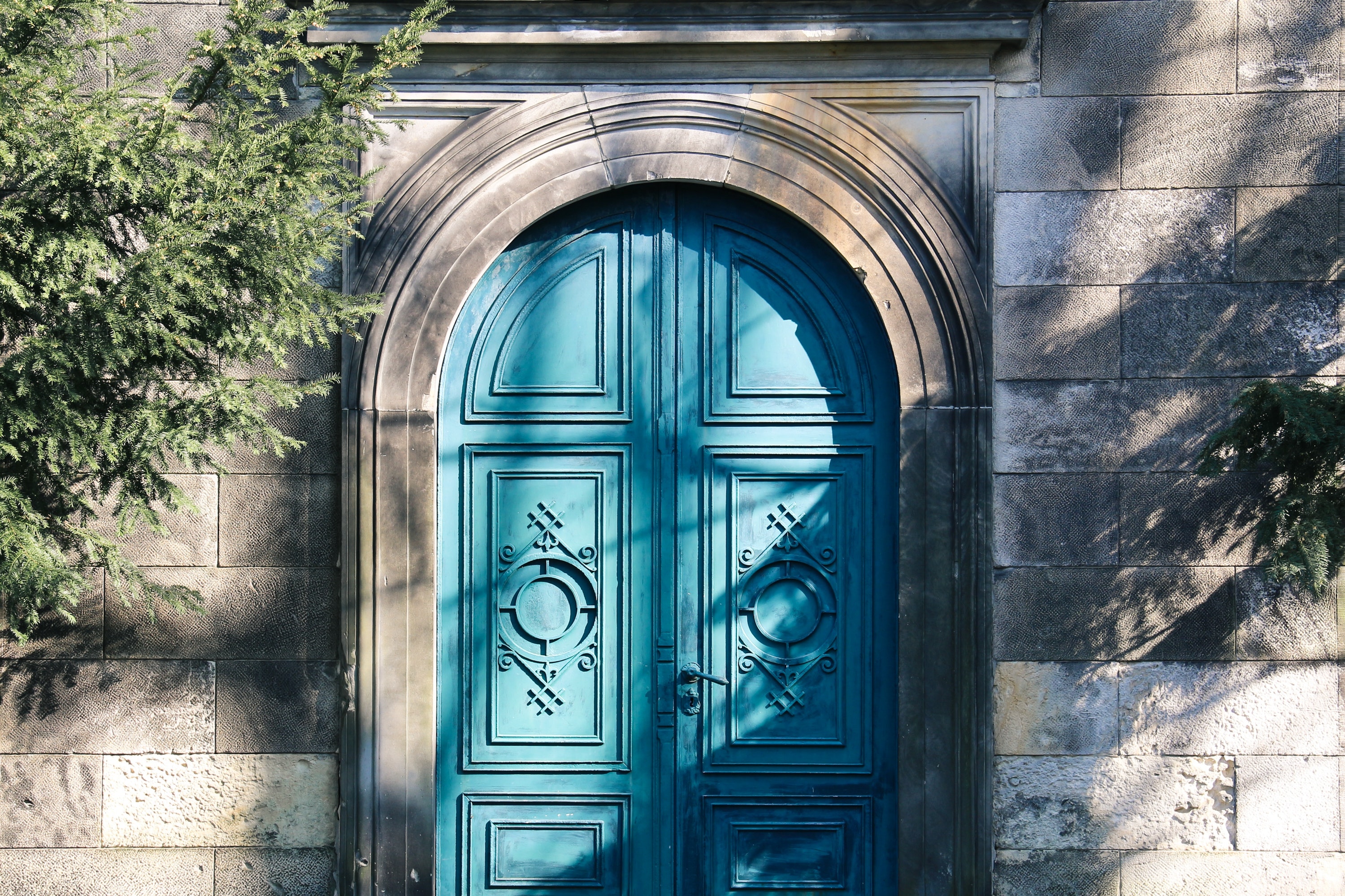 Light blue door in stone building