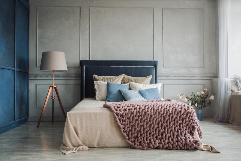 beautiful bedroom with blue and grey walls