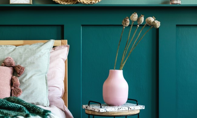 dark green wall paneling in bedroom