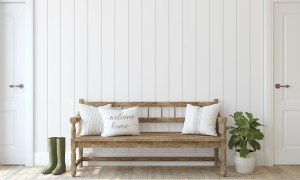 White painted wood paneling on wall