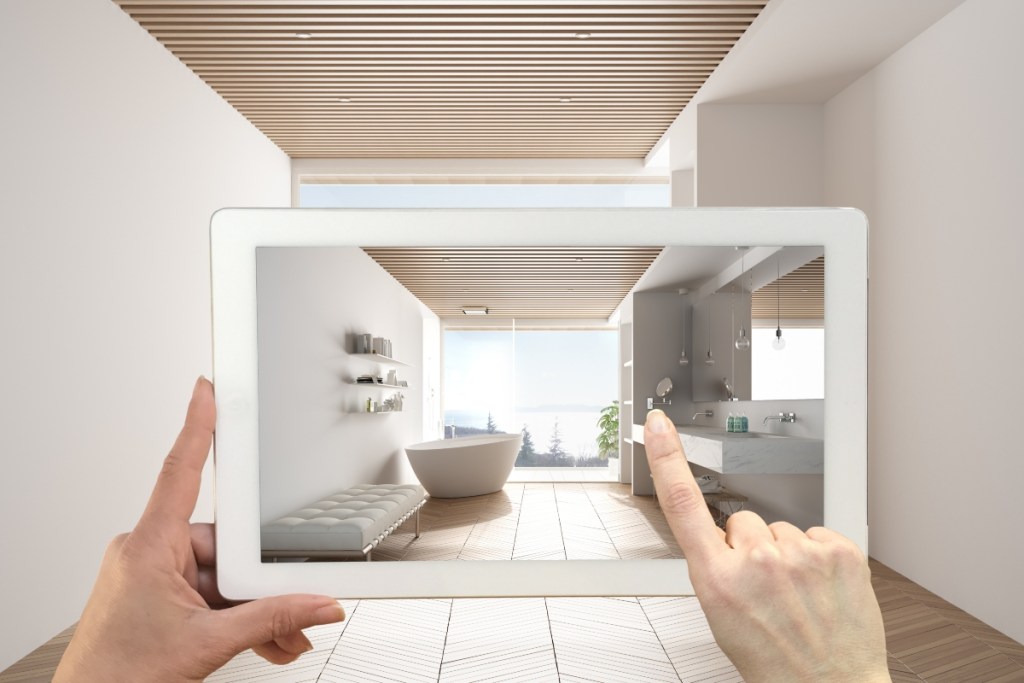 person using an augmented reality app for home design