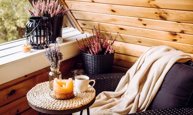 Fall home decor nook with blanket and candle