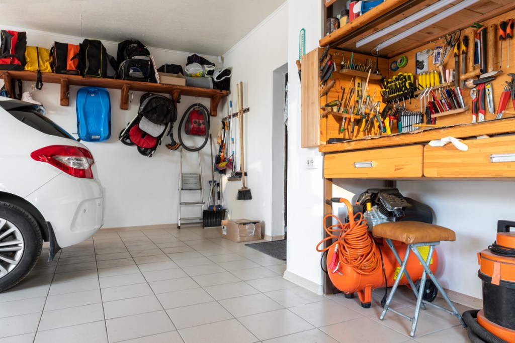 garage interior with car and tool bench