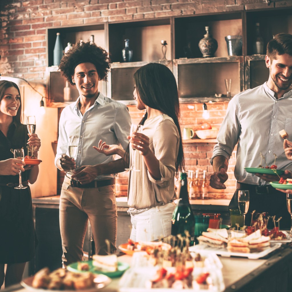 People at a party with snacks and drinks