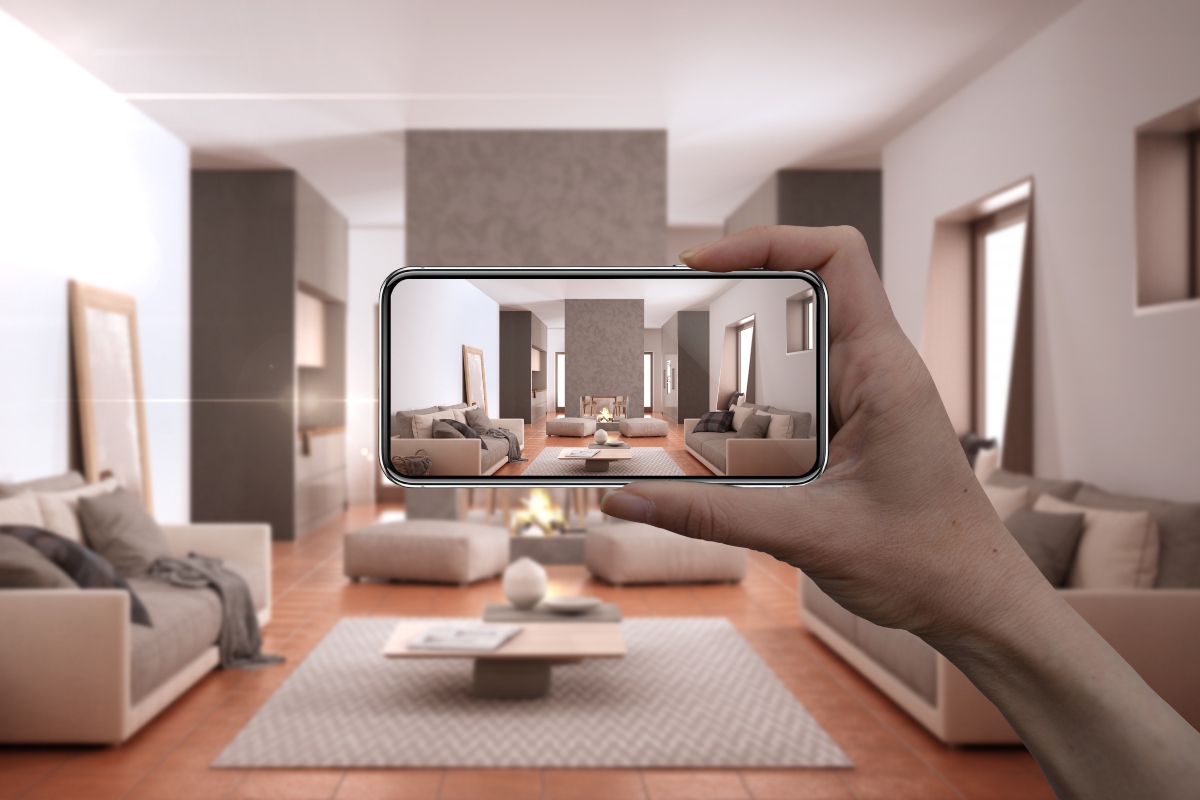 Person holding smartphone for AR home decor