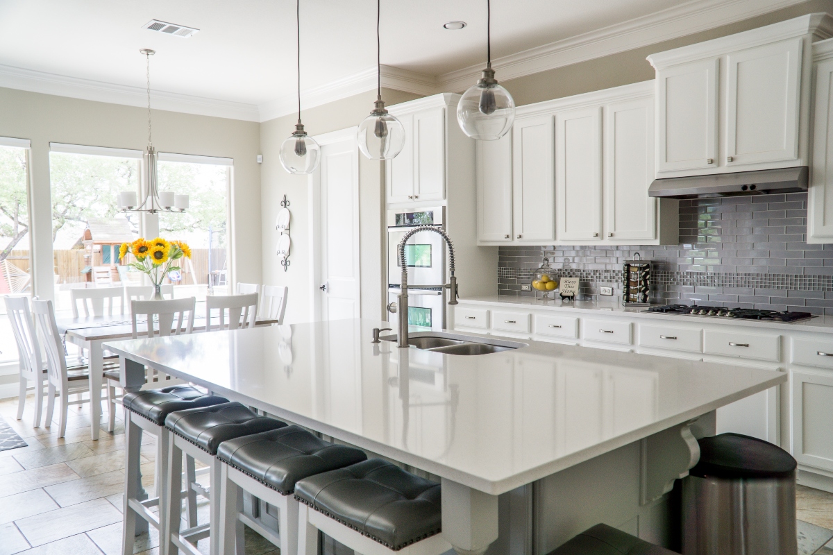 white and grey kitchen with white countertops