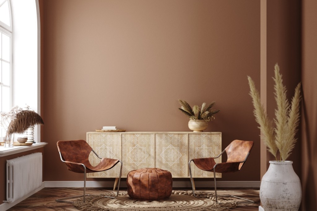 bohemian styled room with warm wall paint color