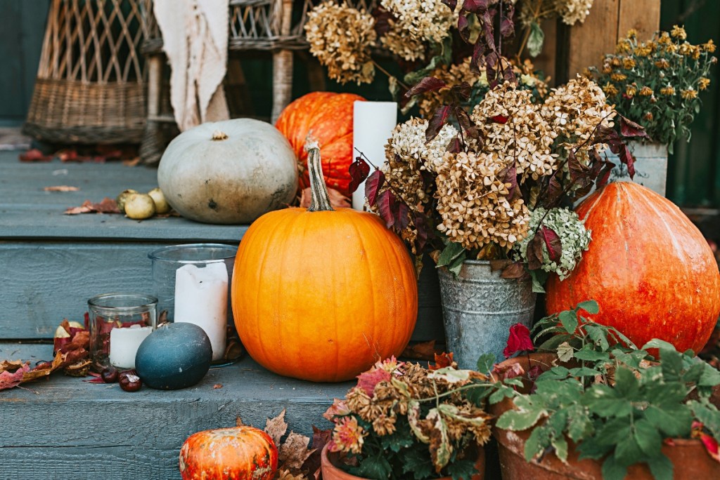 Fall pumpkin decor and flowers on stairs