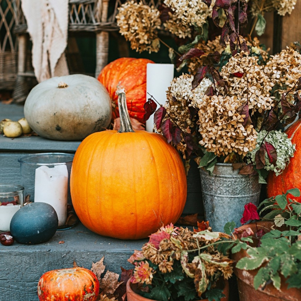 Fall pumpkin decor and flowers on stairs