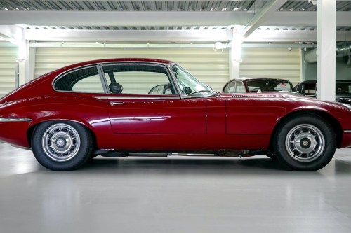 red classic car in garage