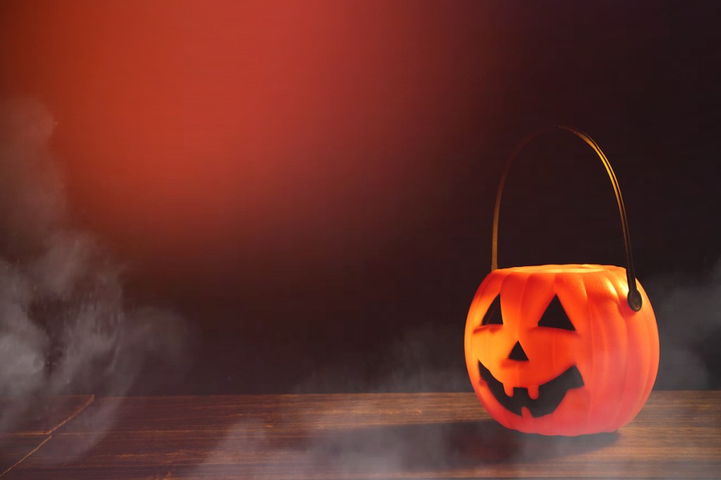 Spooky scene with plastic pumpkin