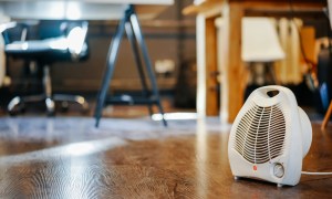 white space heater on hardwood floor in office