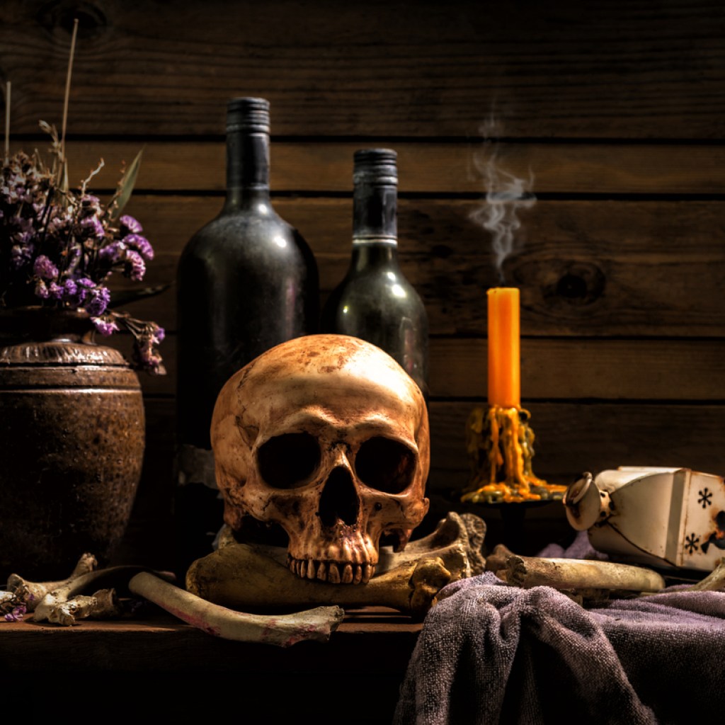 skull and candles halloween decor on table