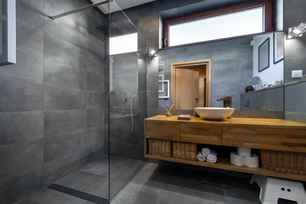 modern bathroom with dark grey tiled shower