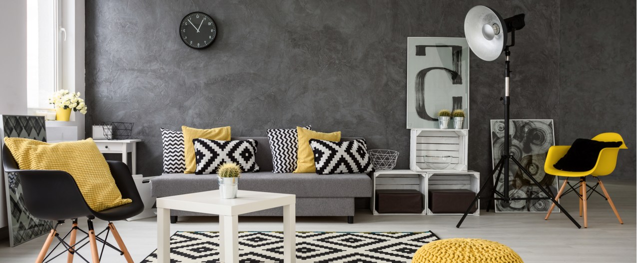 Modern living room with gray walls and yellow furniture