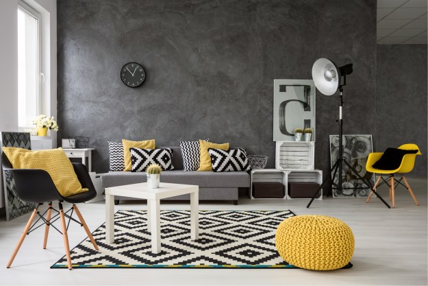 Modern living room with gray walls and yellow furniture