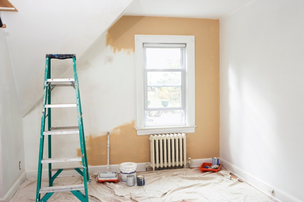 bedroom renovation with ladder and paint