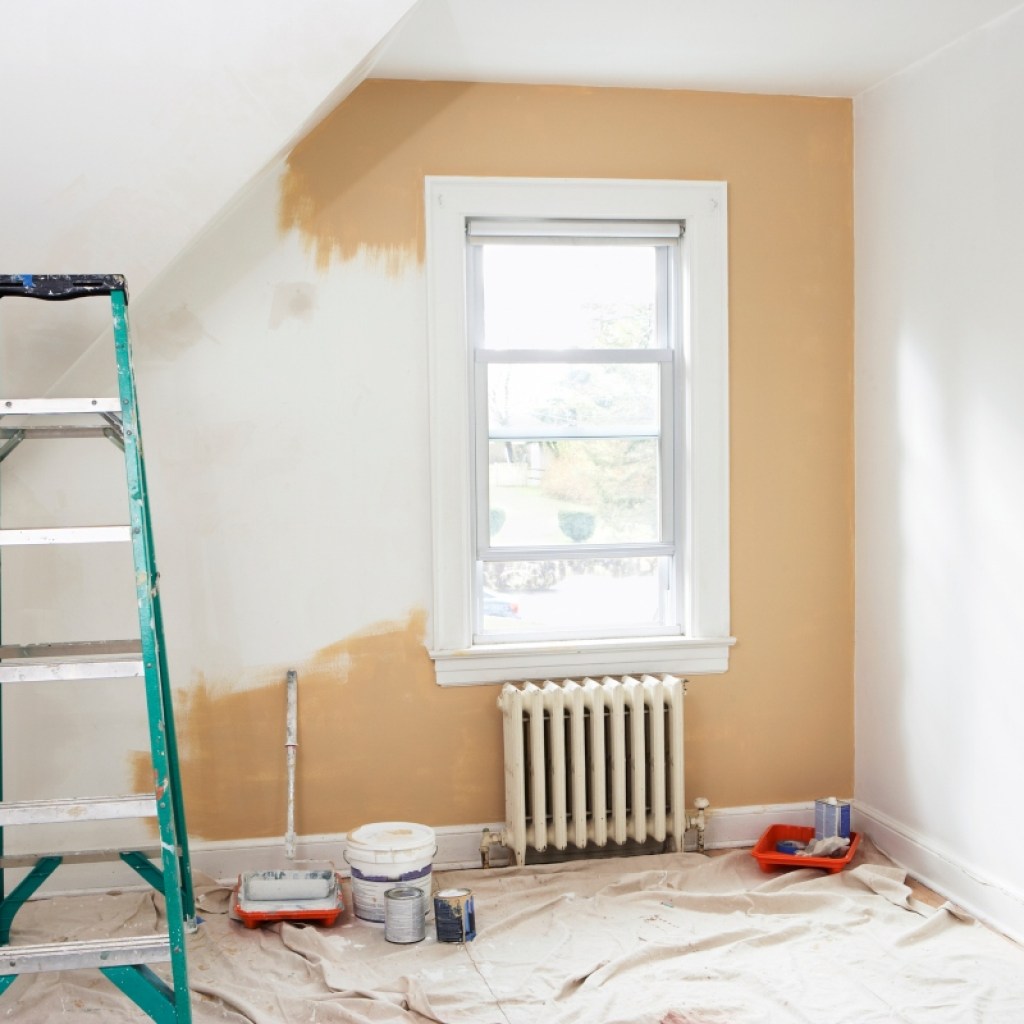 bedroom renovation with ladder and paint