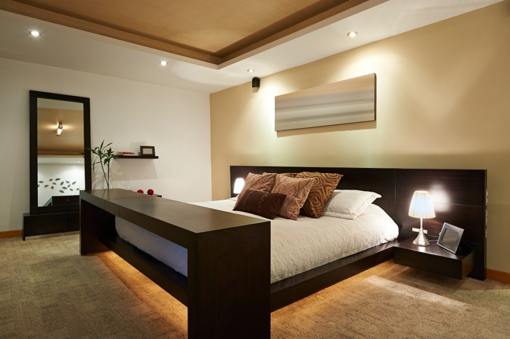modern bedroom with under bed lighting and backlights