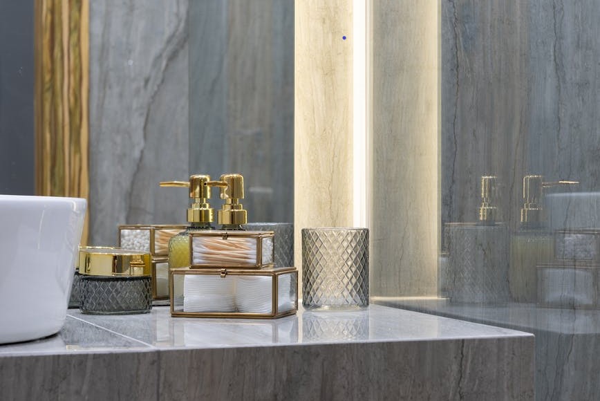 bathroom with marble sink and walls