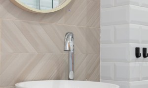 White bathroom sink on counter and mirror