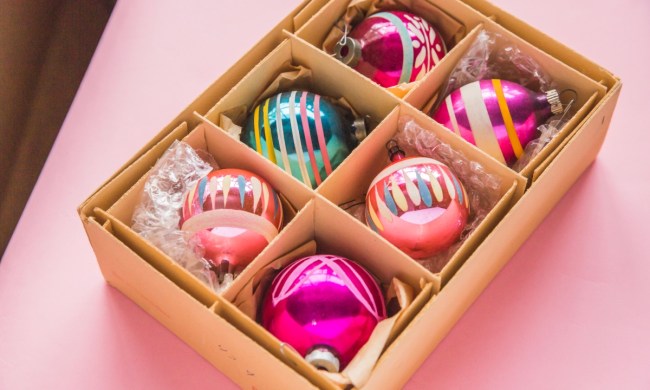 Colorful pink Christmas ornaments in a box