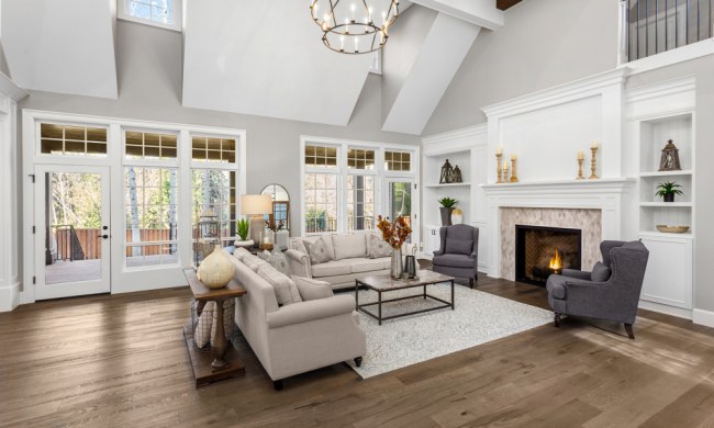 Luxurious neutral and white living space open concept with chandelier