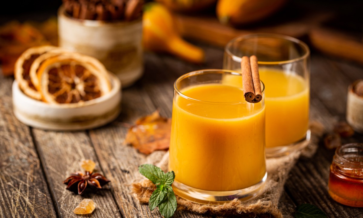 Pumpkin and orange spiced fall cocktail with cinnamon