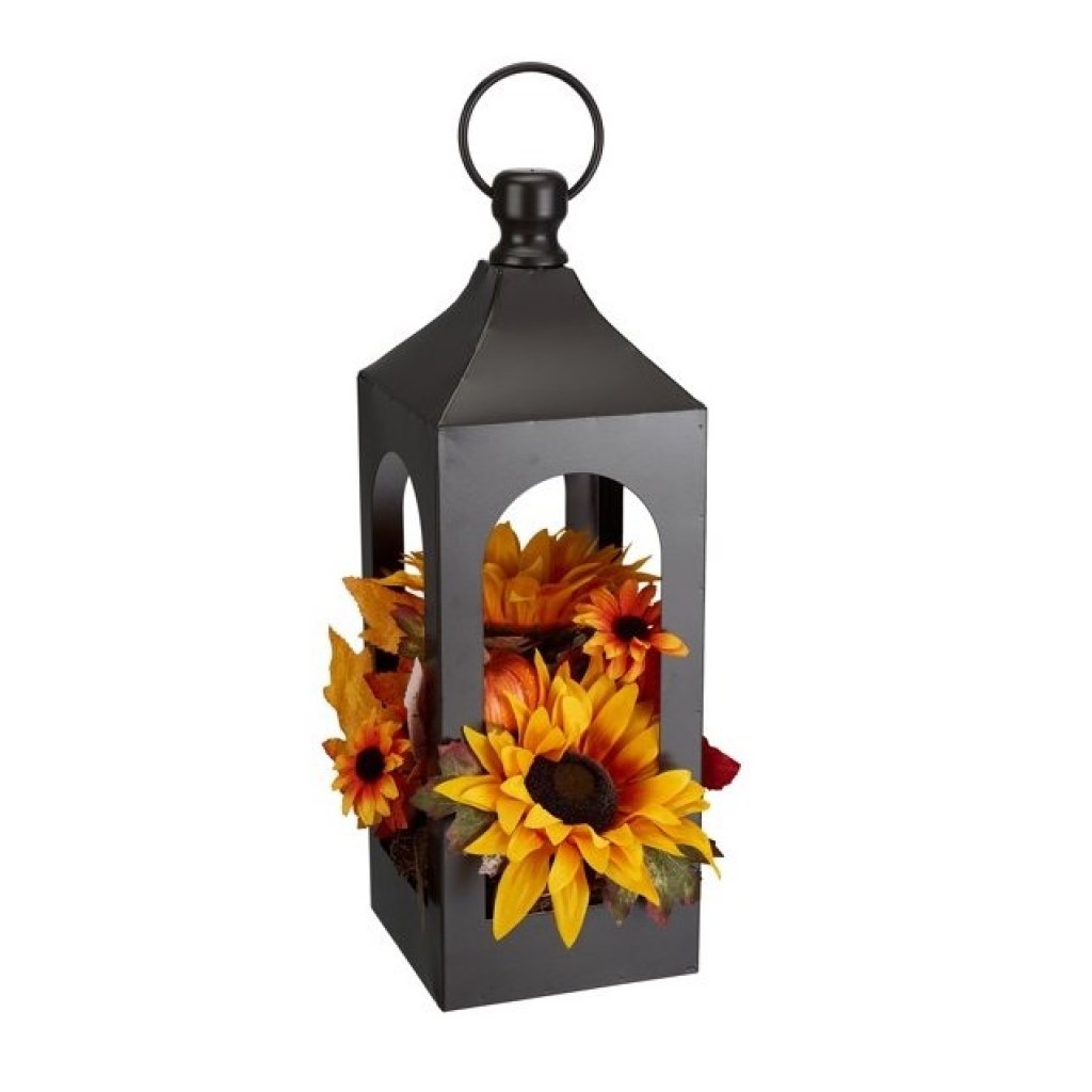 Rustic steel lantern decoration with floral arrangement.