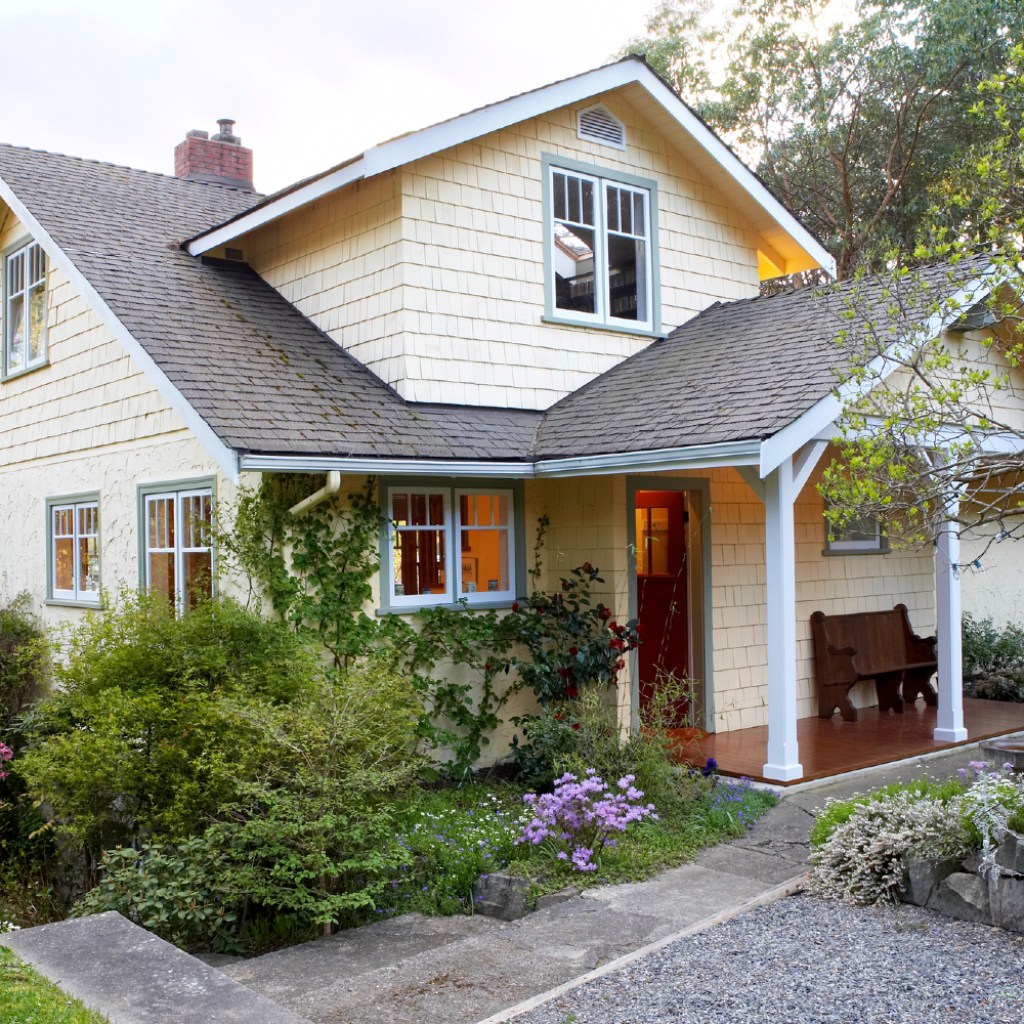 The exterior of a light yellow house