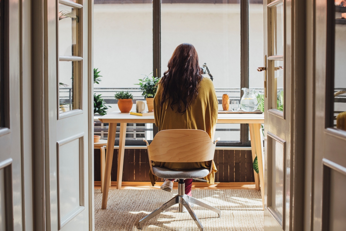 woman sitting at a desk in a mobile office chair