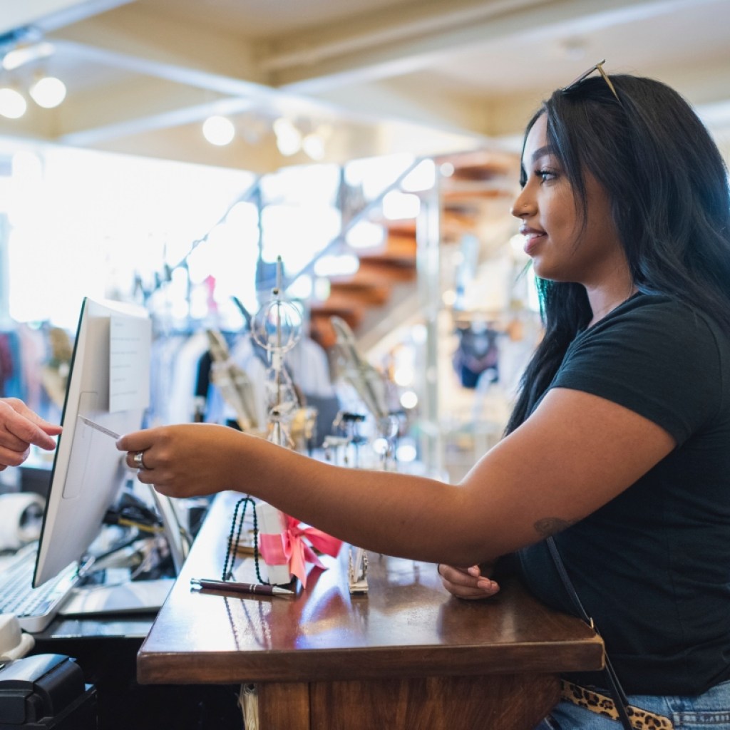 woman shopping in store with a credit card