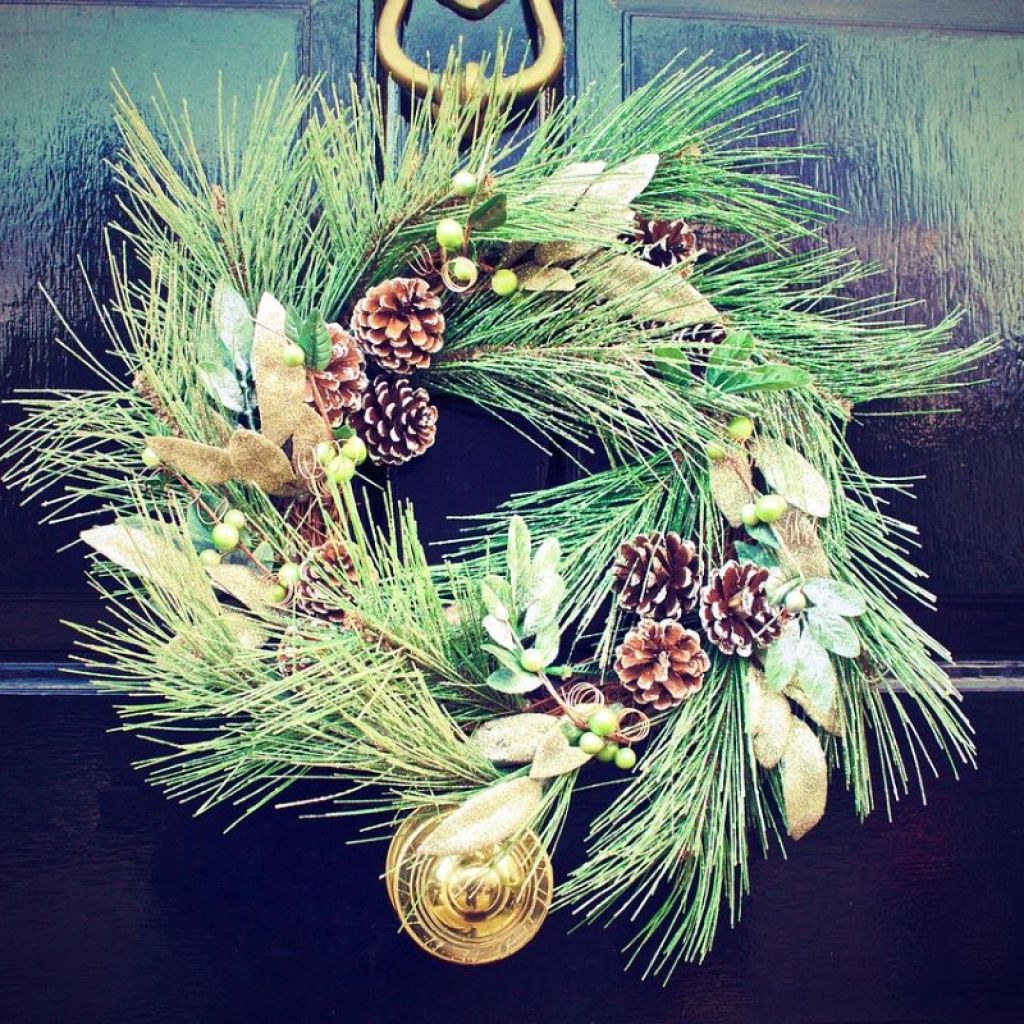 holiday wreath on a black door