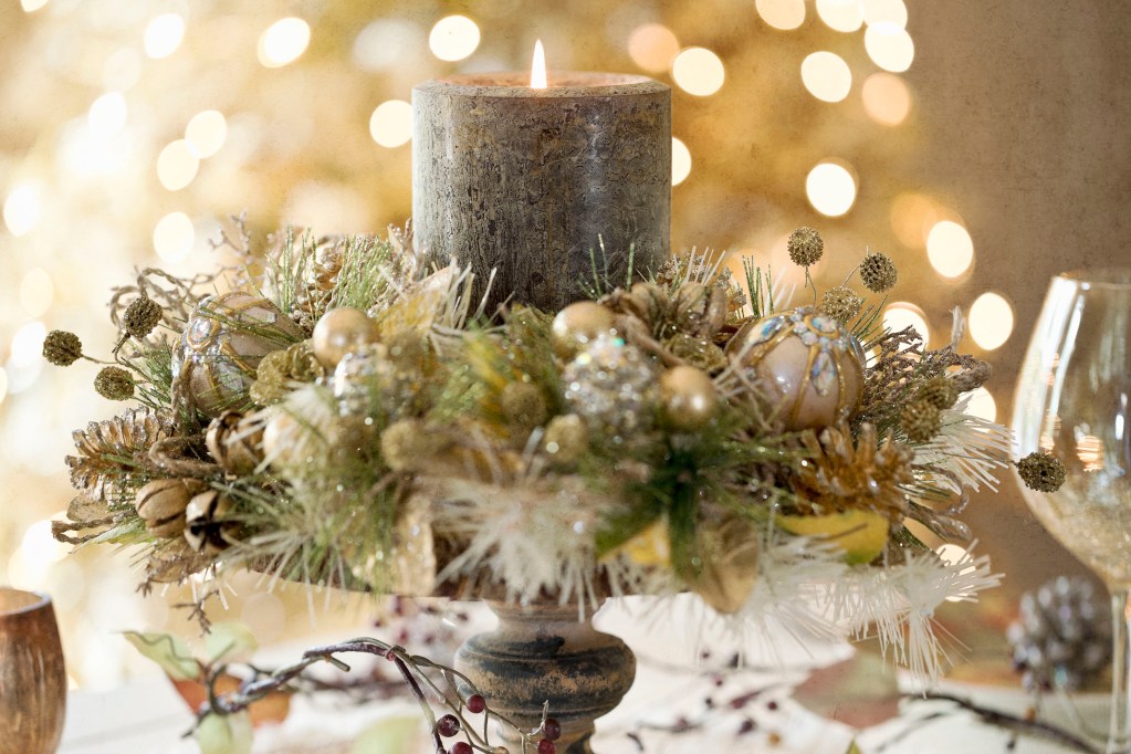 Christmas centerpiece wreath wrapped around a candle