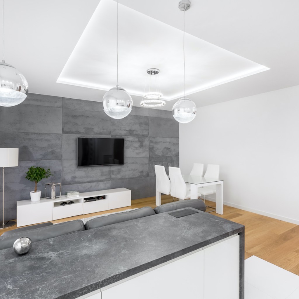 modern home with soapstone countertop and concrete wall