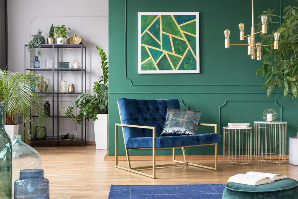 green living room with gold accent pieces